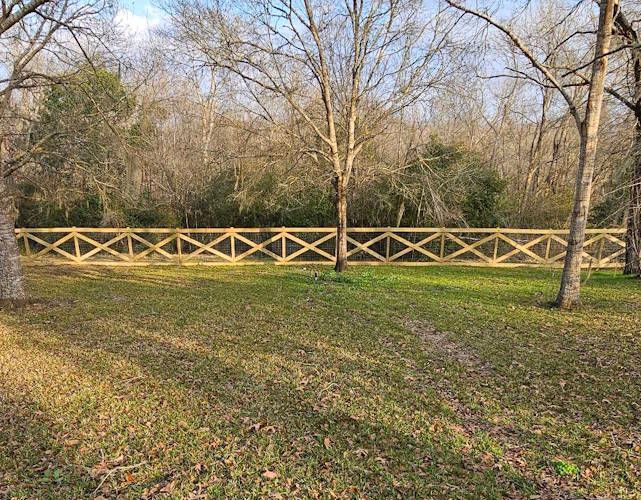 New fence installed with toe kick boards and cross bracing